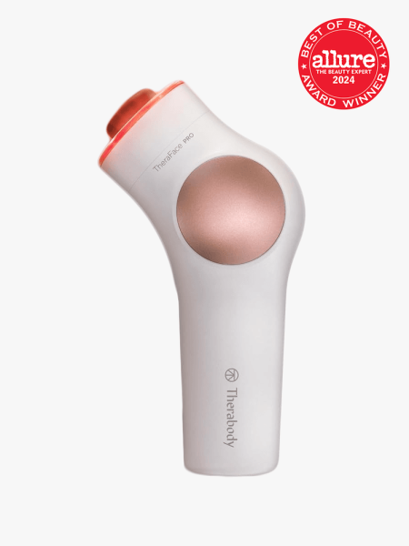 Therabody TheraFace Pro in branded component on a light gray background